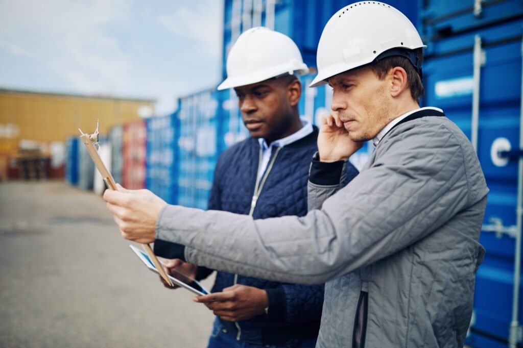 Engineers at work in a large commercial shipyard